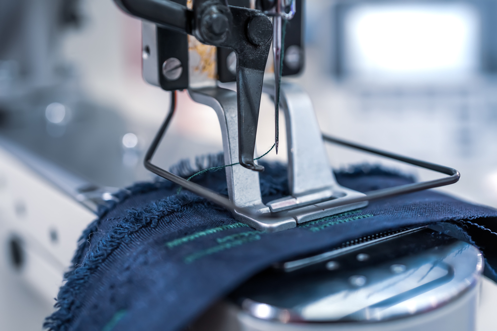 Professional sewing machine close-up. Modern textile industry.