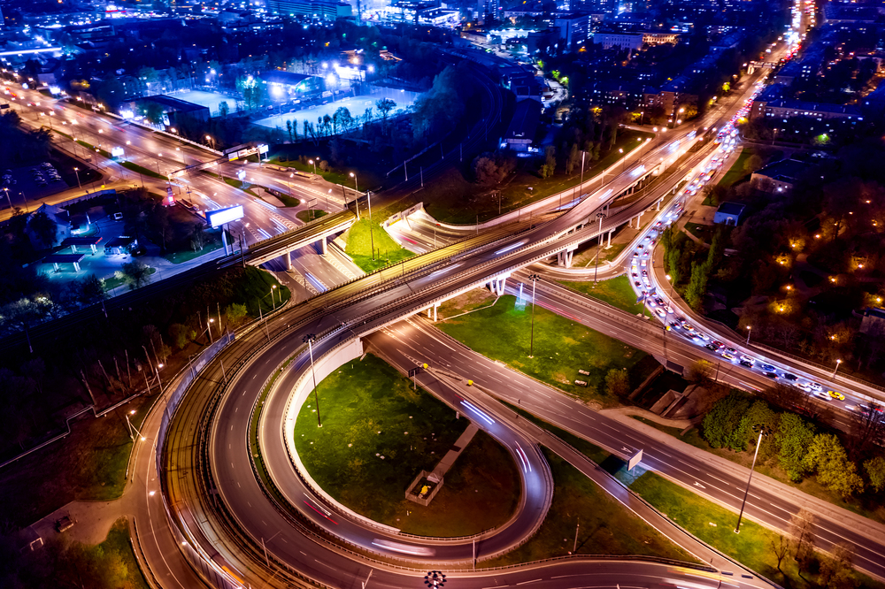 Night Aerial view of a freeway intersection traffic trails in night Moscow