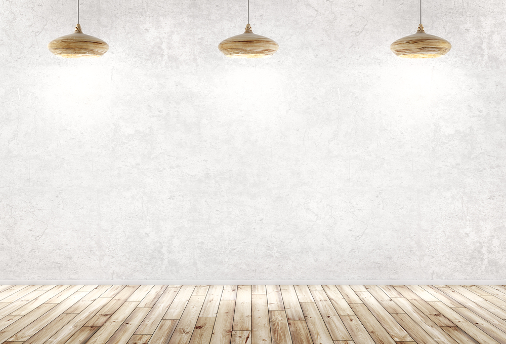 Interior background of a room with three wooden lamps over concrete wall, wooden floor 3d rendering