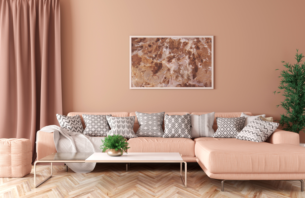 Modern interior of living room with peach corner sofa, coffee table 3d rendering