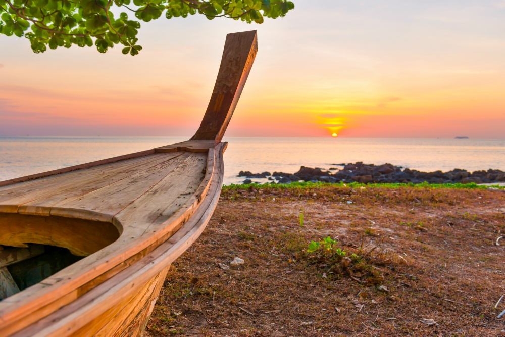 Wooden boat on sunset beach. Boat sunset beach landscape