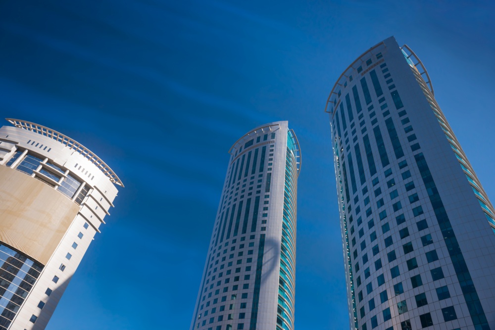 Skyscrapers and modern office buildings at downtown of Doha city on clear sky background. Doha, Qatar