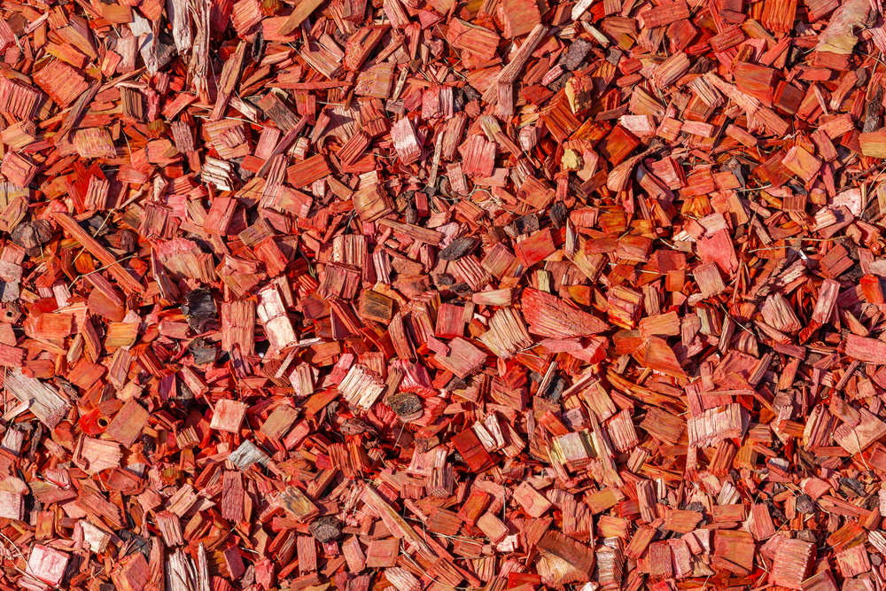 lawn strewed by red wooden chips, seamless texture