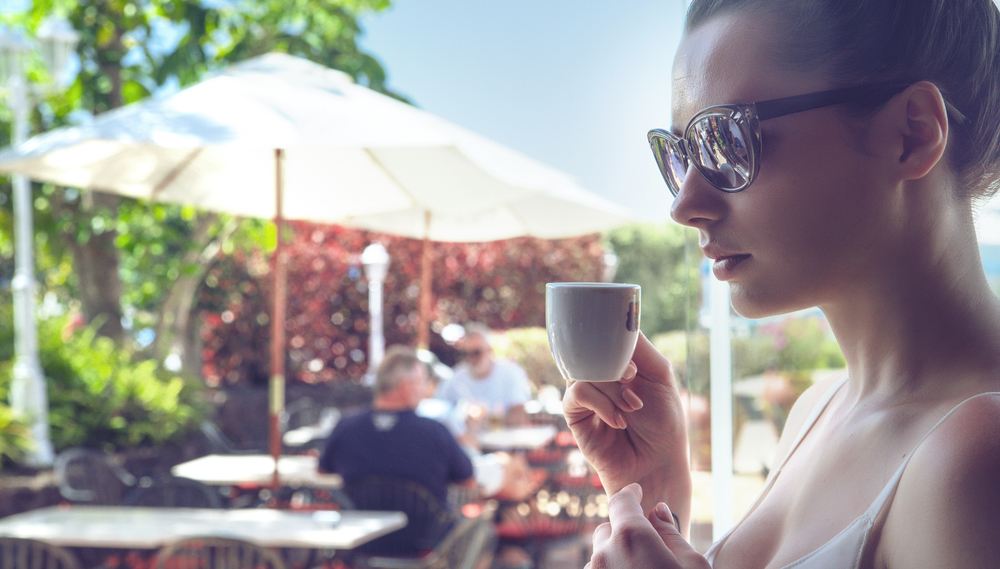 Portrait of an attractive woman drinking a coffee