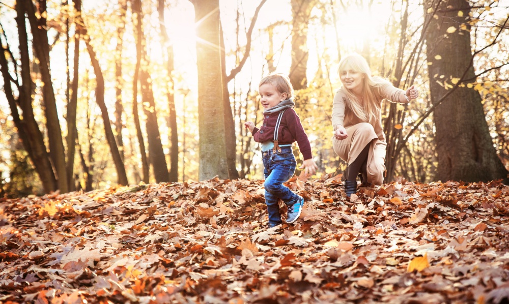 Cheerful family enjoying great, autumnal weather
