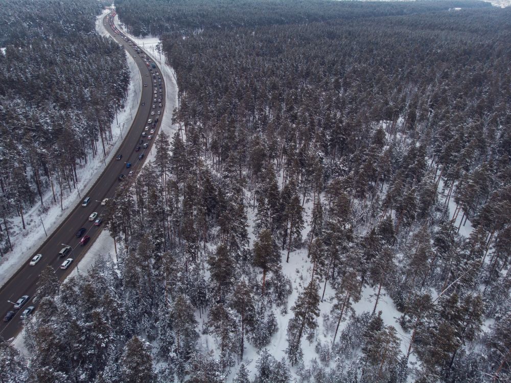 Aerial view of a road in winter landscape. Aerial view of a winter road
