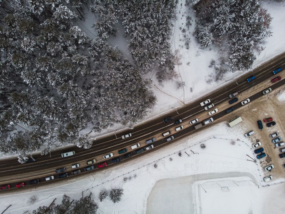 Aerial view of a road with traffic in winter landscape. Aerial view of a road in winter landscape