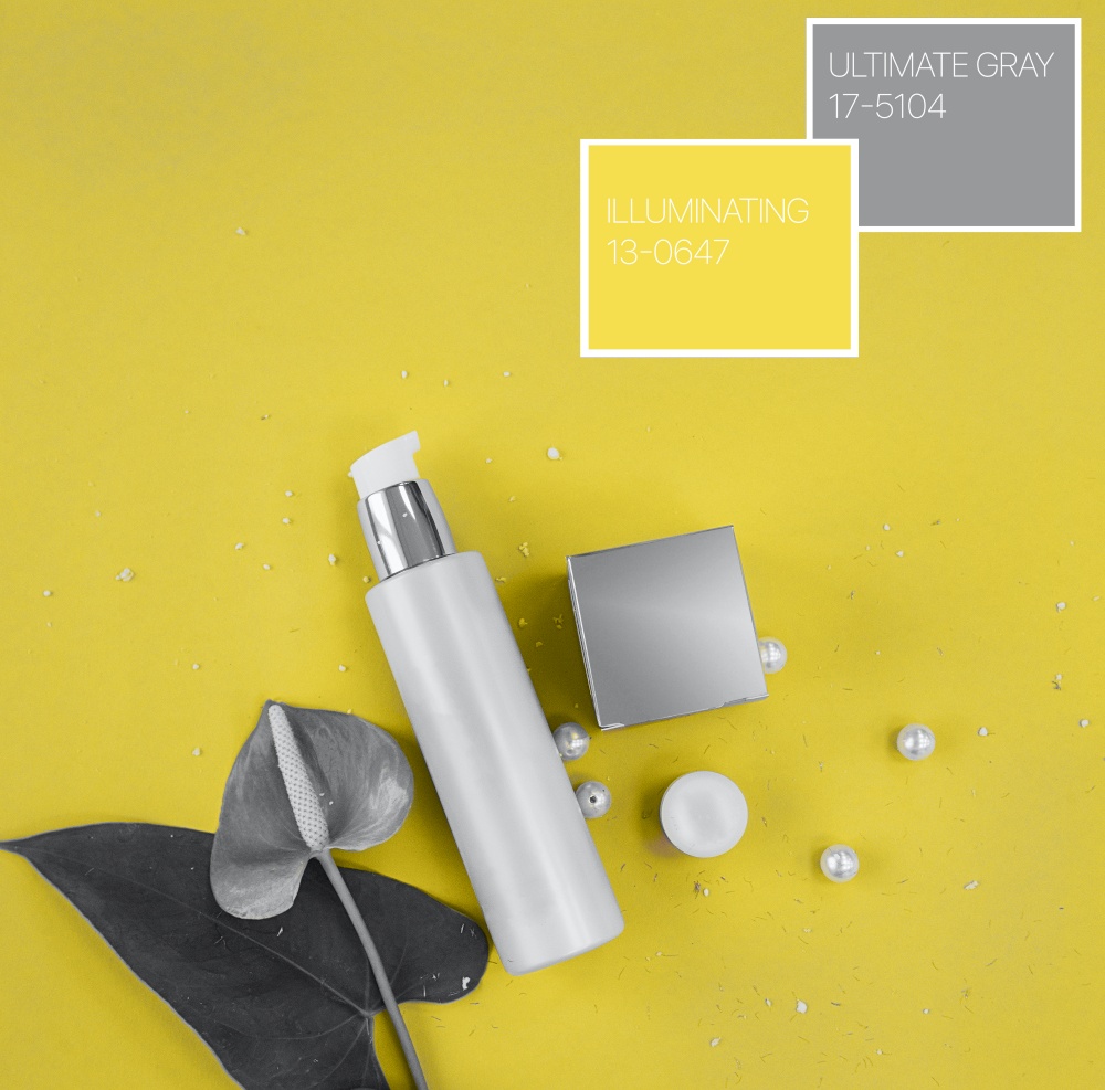Colors of the year 2021: Ultimate Gray and Illuminating yellow concept. Makeup cosmetic products, flat lay, top view.. Colors of the year 2021: Ultimate Gray and Illuminating yellow concept