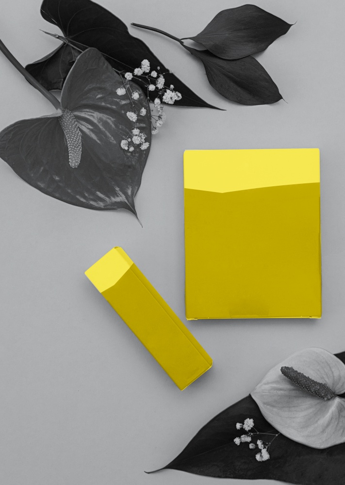 Colors of the year 2021: Ultimate Gray and Illuminating yellow concept. Makeup cosmetic products, flat lay, top view.. Colors of the year 2021: Ultimate Gray and Illuminating yellow concept