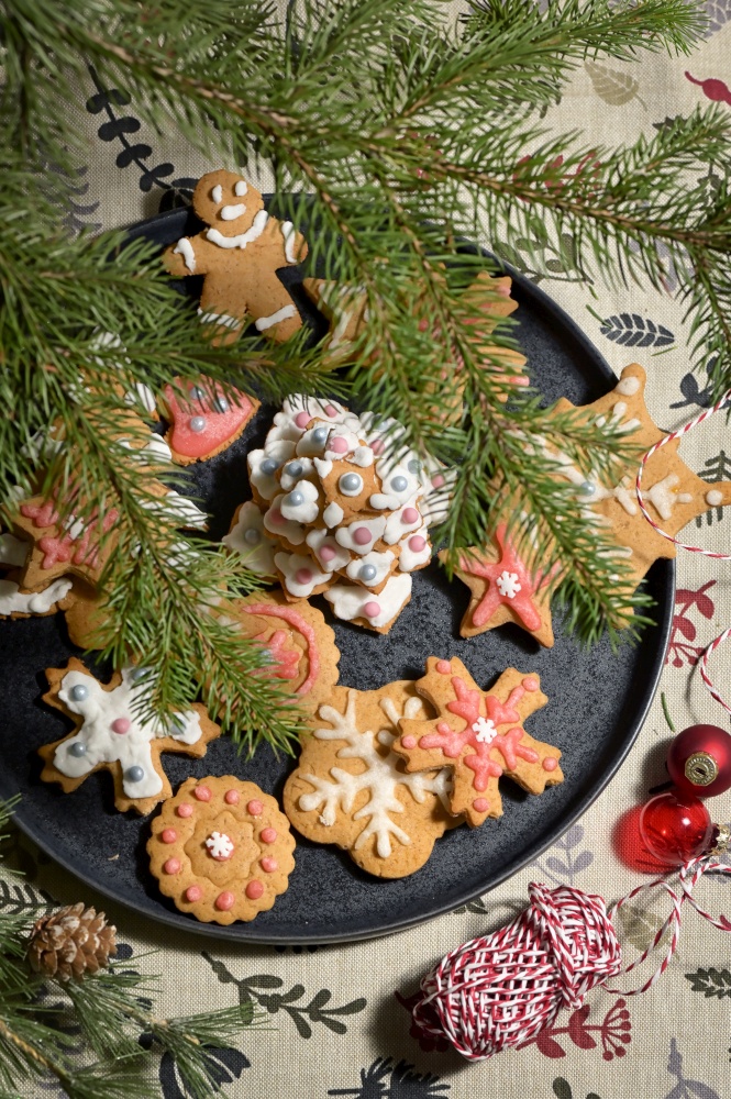Gingerbread Christmas Cookie on Plate and Pine Brunches