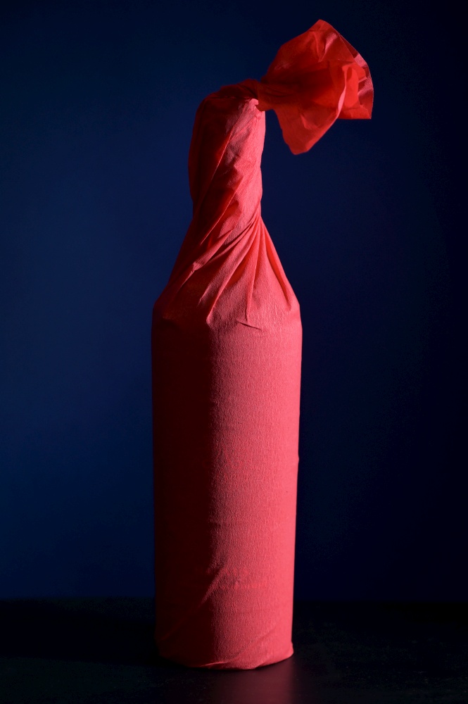 Red Paper Wrap Wine Bottle shoot in studio