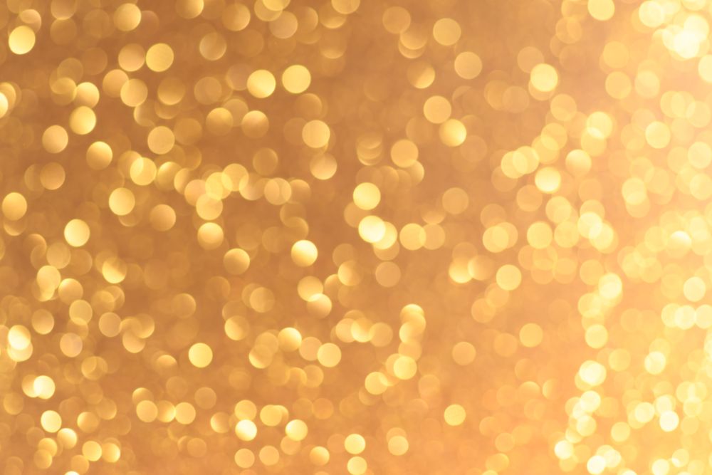 Golden Christmas or New Year festive background. Yellow Christmas or New Year background