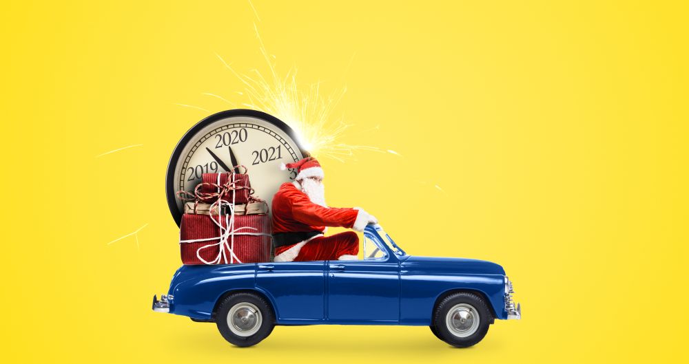 Christmas countdown arriving. Santa Claus on snowy toy car delivering New Year gifts and clock at yellow background. Santa Claus countdown on car