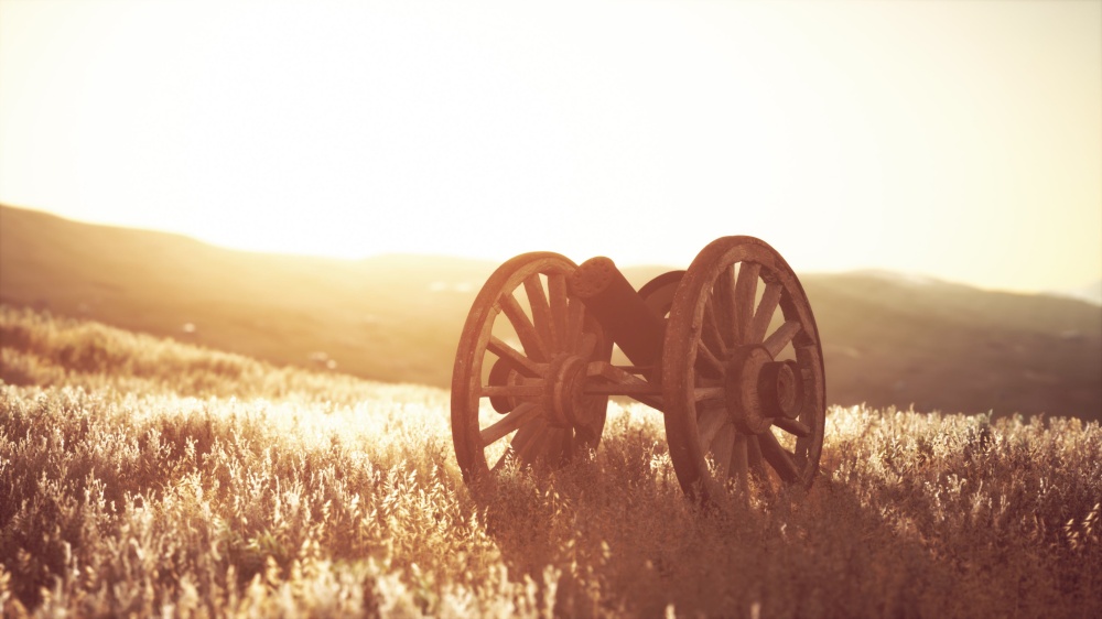 historic war gun on the hill at sunset