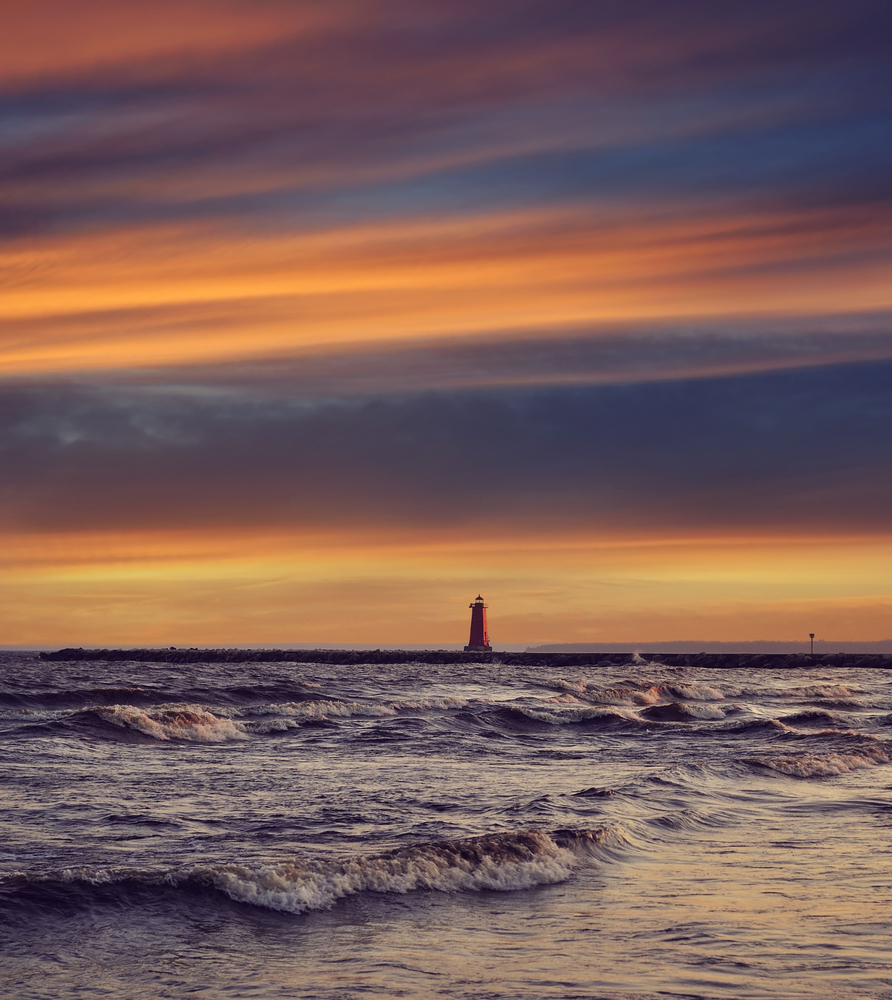 view of the Manistique lighthouse at sunset