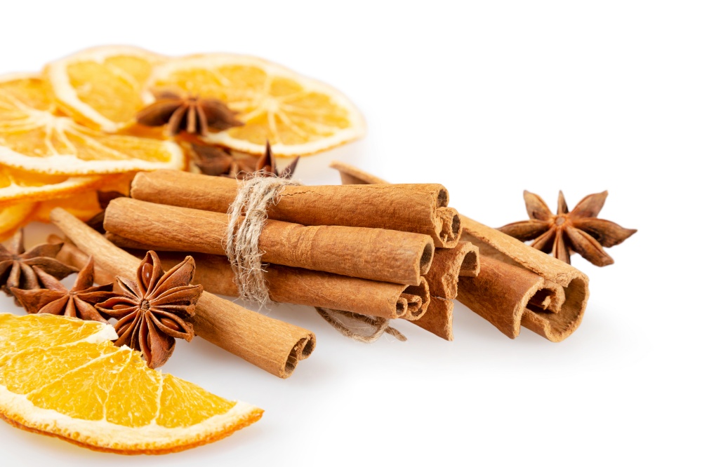 Dried orange slices, cinnamon and star anise. Spices for mulled wine on a white background.