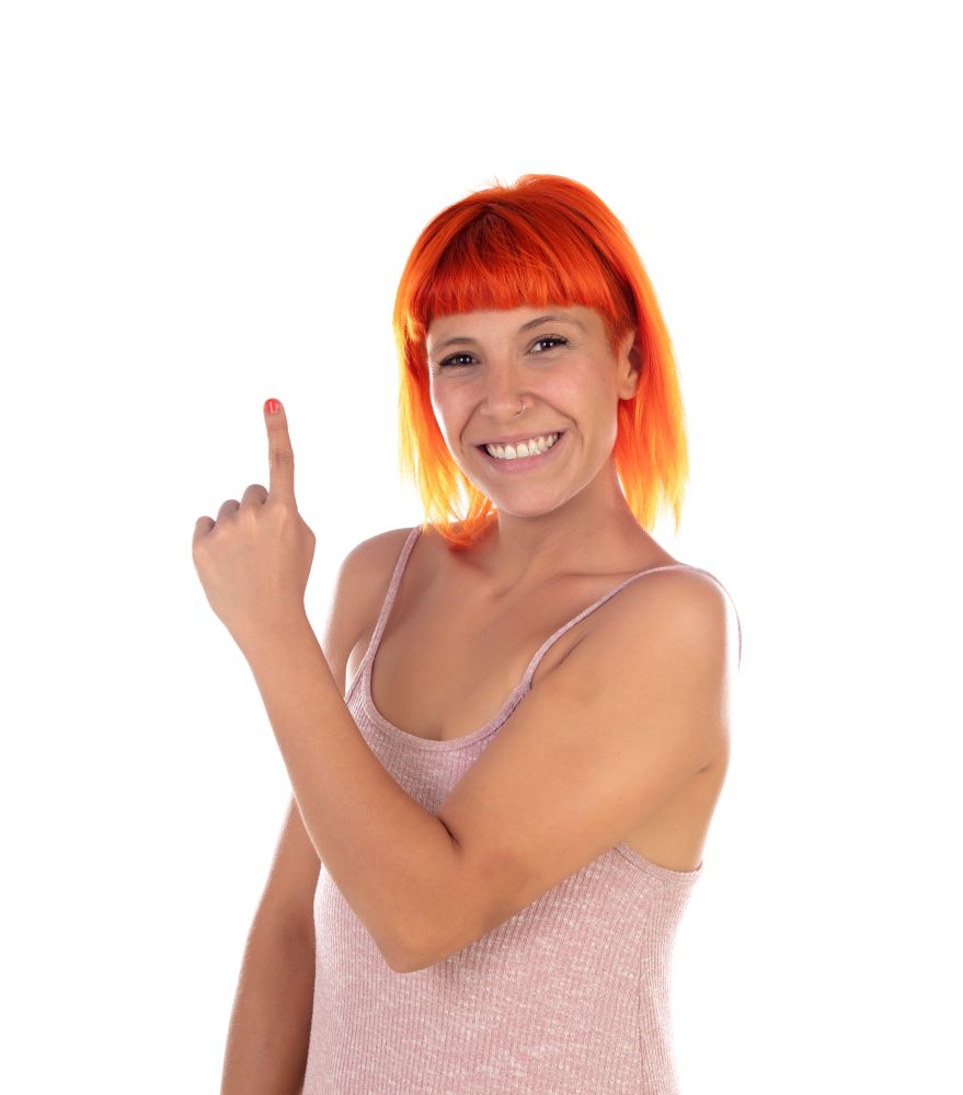 Woman showing something with her finger isolated on a white background