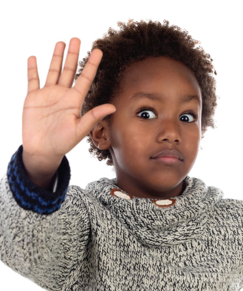 Funny african child saying Stop with his hand isolated on a white background