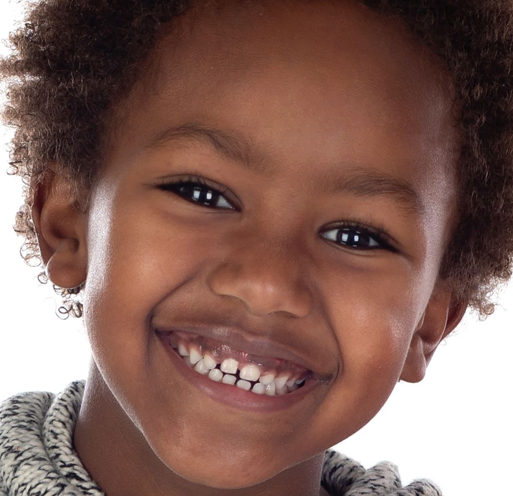 Beautiful smile of a happy child isolated on a white background