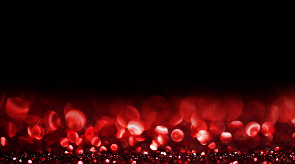 Abstract background with red shiny glitter bokeh lights. Bokeh lights background