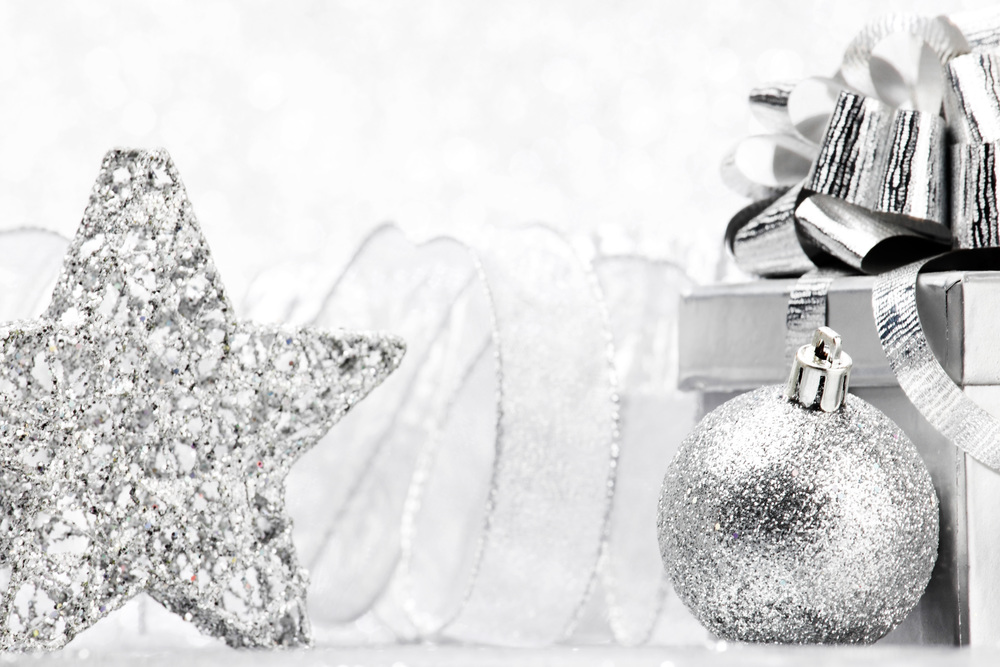 Christmas gift and decoration on shiny glitter background