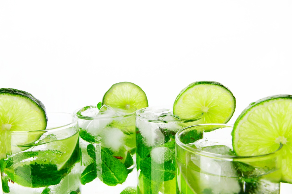 Mojito cocktails with lime and mint isolated on white background. Mojito cocktails with lime