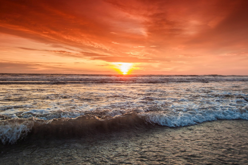 Radiant sea beach sunset ocean vawes close up. Radiant sea beach sunset