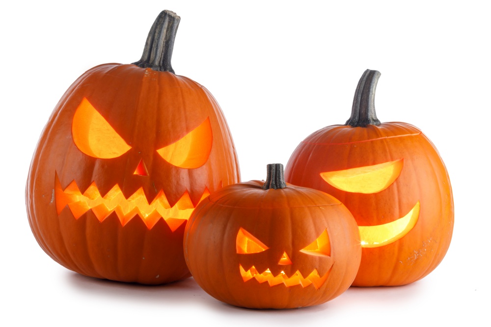 Three glowing Halloween Pumpkin lanterns isolated on white background. Three Halloween Pumpkins on white
