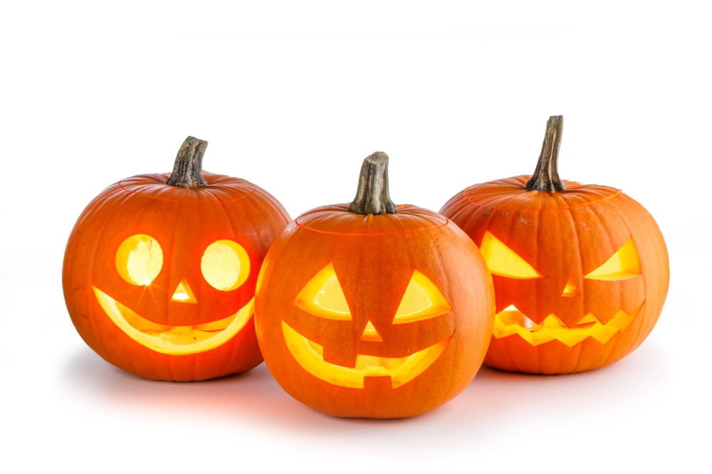 Three Halloween glowing lantern pumpkins in a row isolated on white background. Three Halloween lantern pumpkins