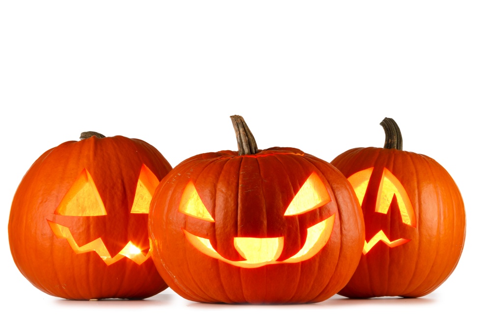Three Halloween glowing lantern pumpkins in a row isolated on white background. Three Halloween lantern pumpkins