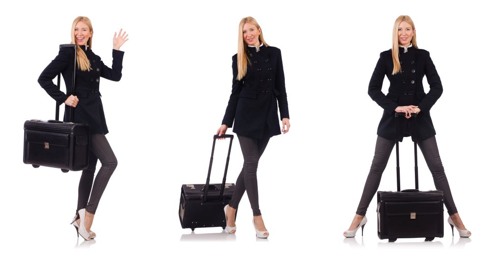 Beautiful woman in black coat with suitcase