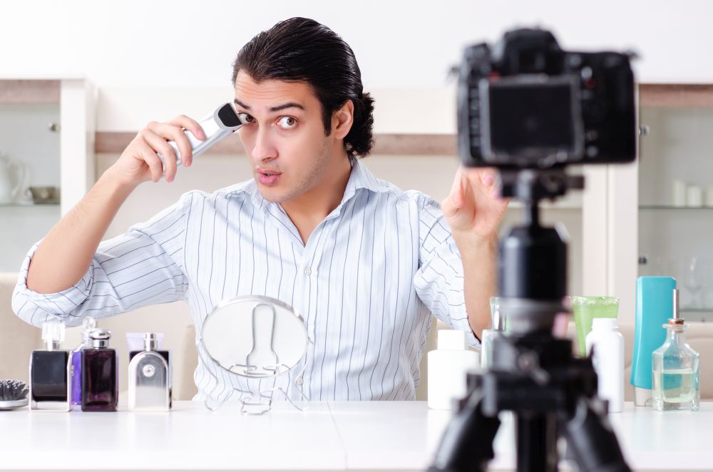 The young handsome man recording his blog in hygiene concept . Young handsome man recording his blog in hygiene concept