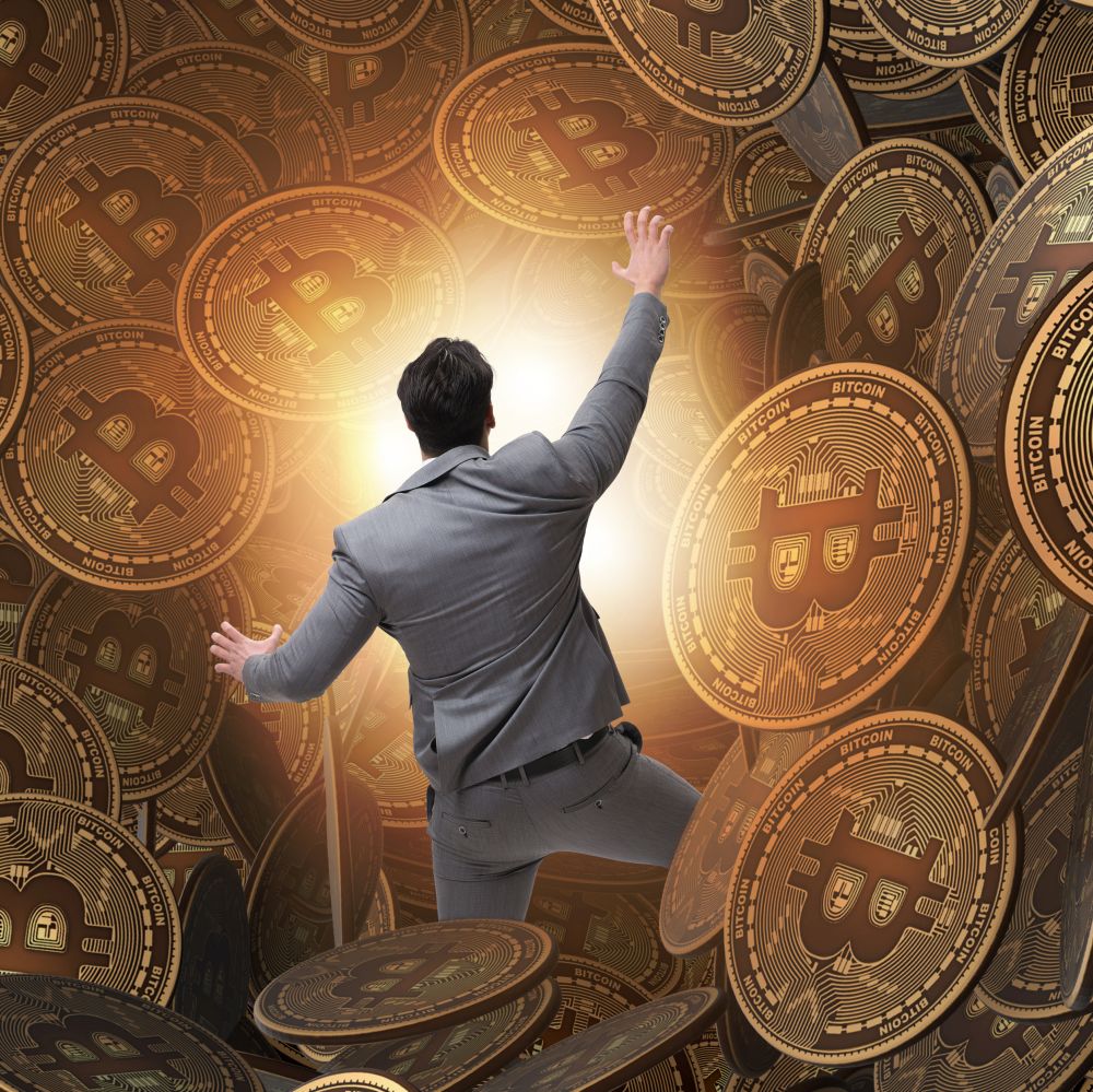 The businessman falling into sinkhole of cryptocurrency bitcoin. Businessman falling into sinkhole of cryptocurrency bitcoin