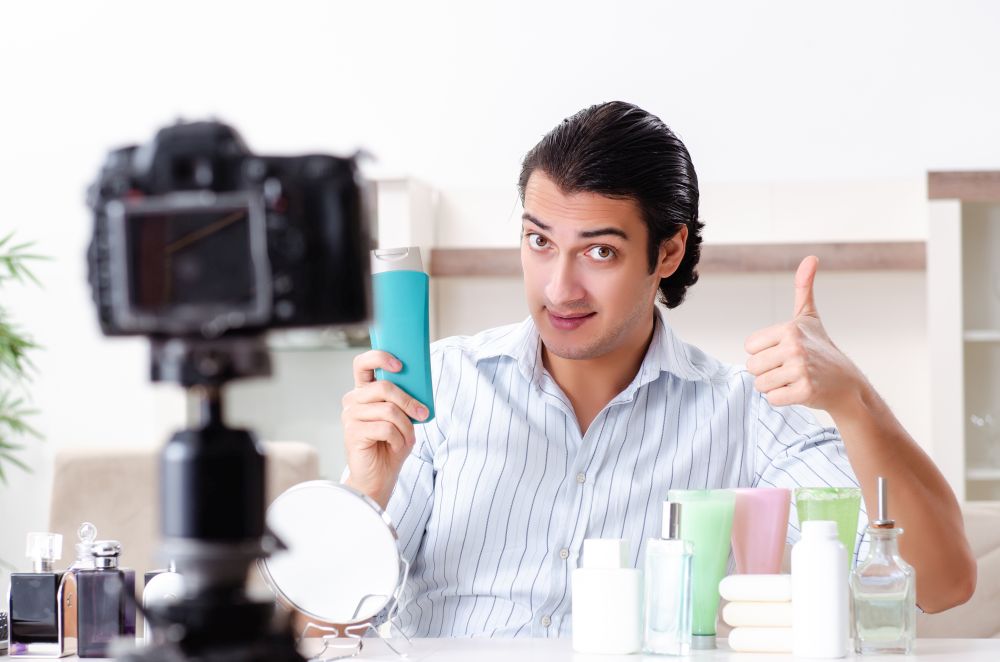 The young handsome man recording his blog in hygiene concept. Young handsome man recording his blog in hygiene concept