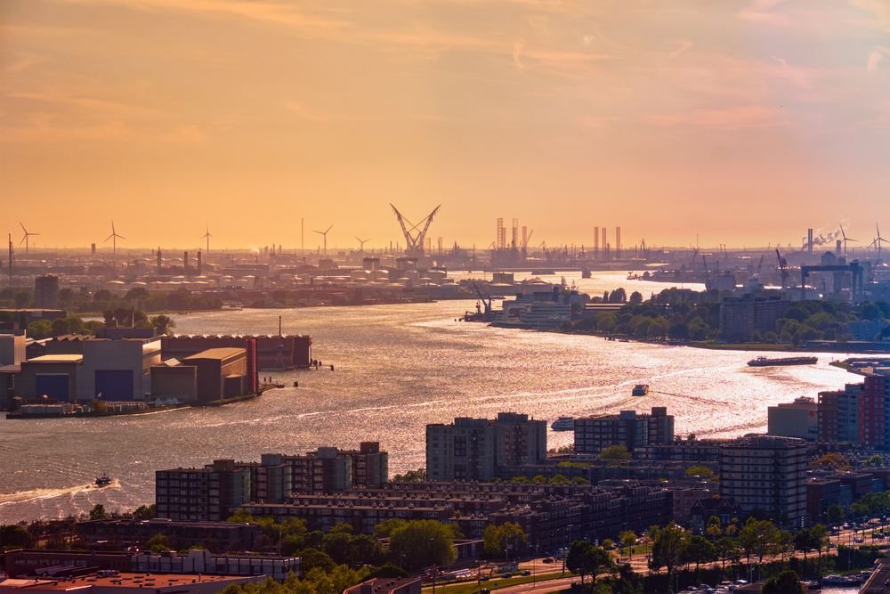 View of Rotterdam port and Nieuwe Maas river on sunset. View of Rotterdam port and Nieuwe Maas river