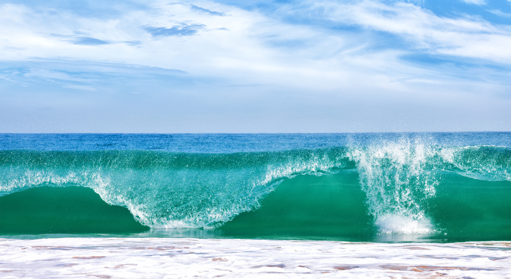 Big wave in ocean with blue sky, panoramic image. Big wave in ocean