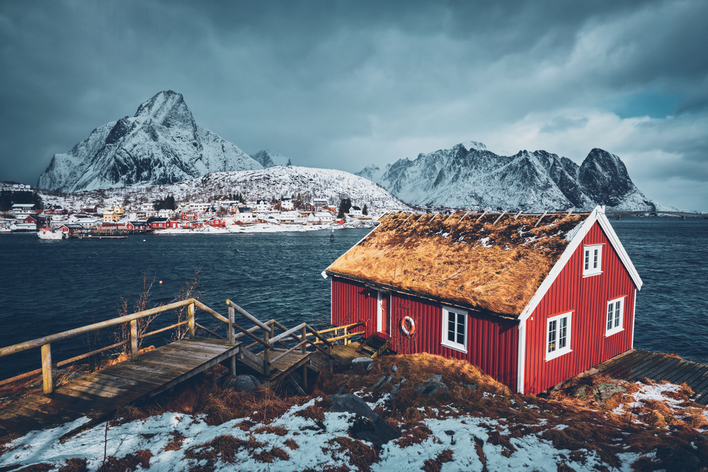 Traditional red rorbu house in Reine village on Lofoten Islands, Norway in winter. Traditional red rorbu house in Reine village on Lofoten Islands,
