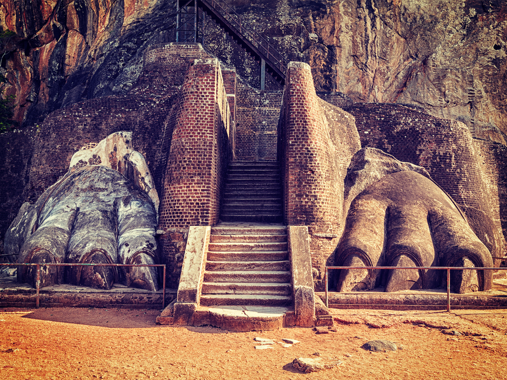 Vintage retro effect filtered hipster style image of famous Sri Lankan tourist landmark - lion&rsquo;s paws pathway on Sigiriya rock, Sri Lanka. Lion paws pathway on Sigiriya rock, Sri Lanka