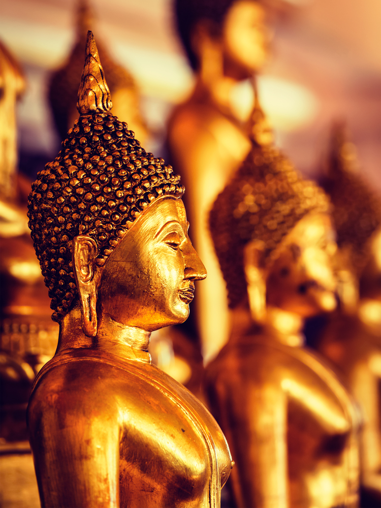 Vintage retro effect filtered hipster style image of golden Buddha statues in buddhist temple Wat Saket (The Golden Mount), Bangkok, Thailand. Golden Buddha statues in buddhist temple