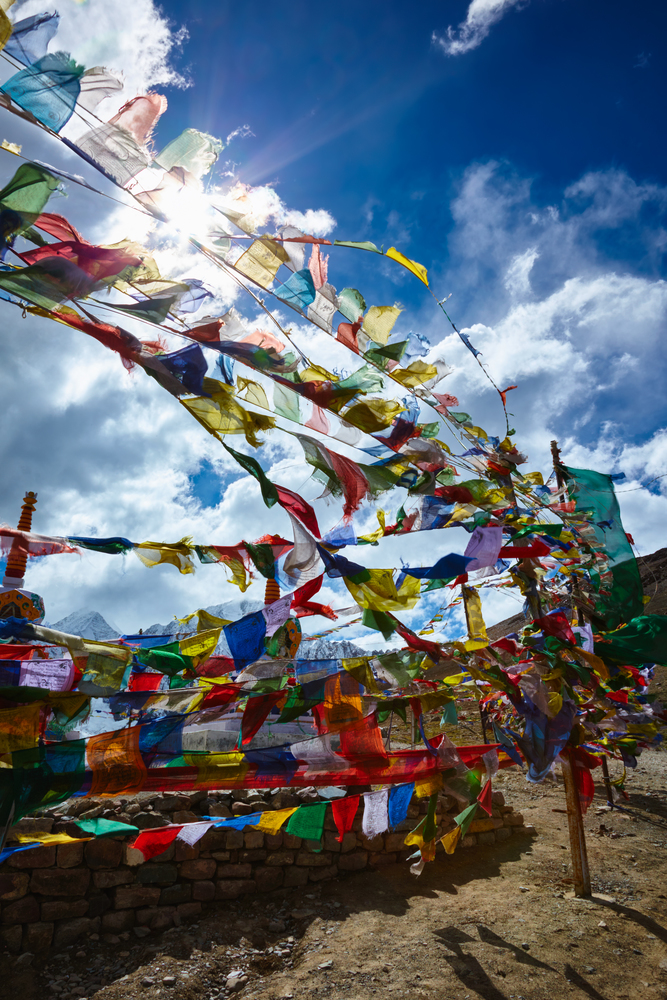 Buddist Prayer flags in Himalayas on top of Kunzum La pass, Himachal Pradesh, India. Elevation  4551 m.. Buddist Prayer flags in Himalayas