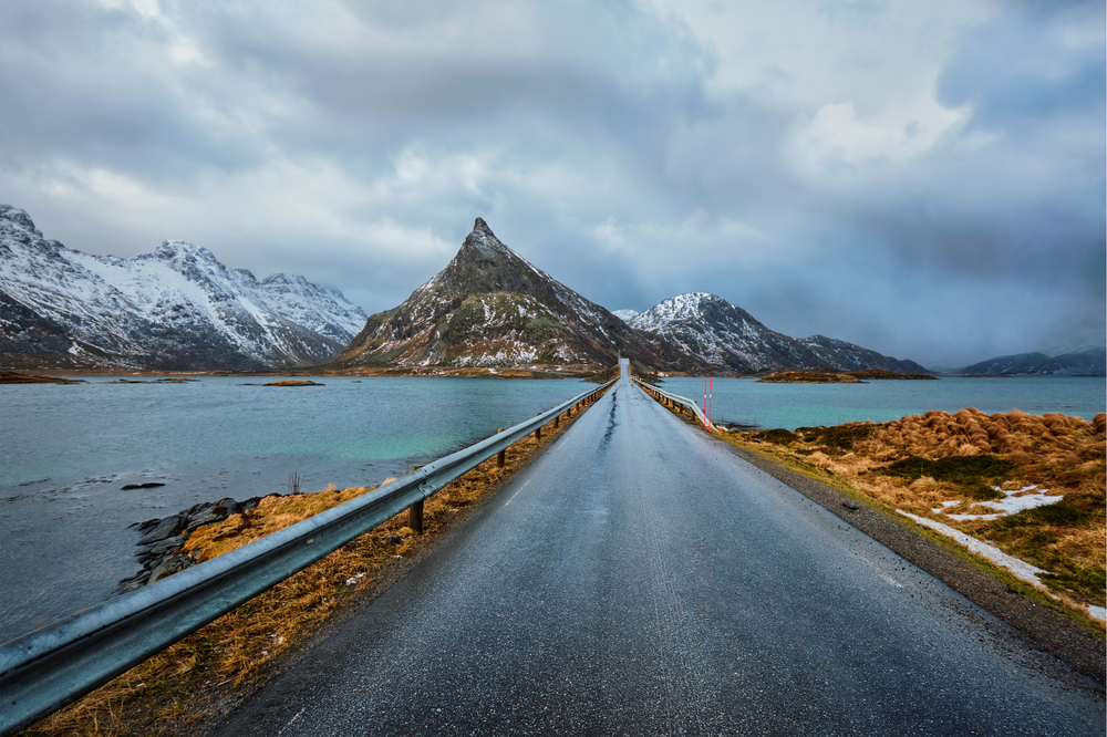 Road in Norwegian fjord. Lofoten islands, Norway. Road in Norway in winter