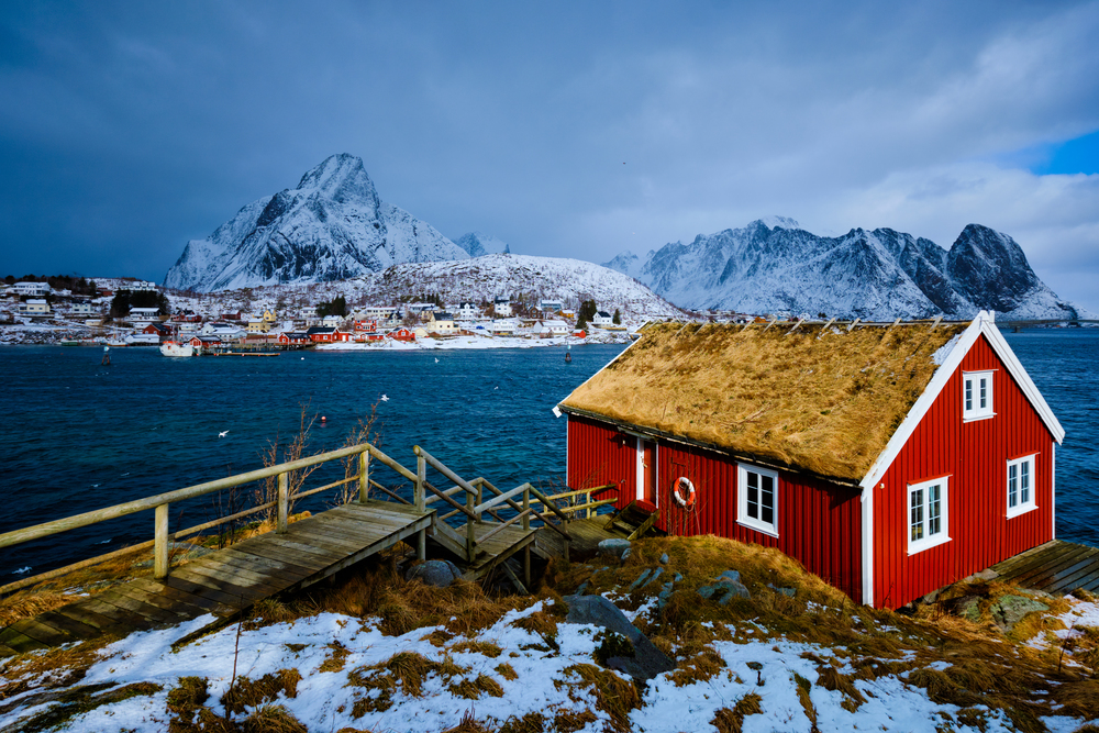 Traditional red rorbu house in Reine village on Lofoten Islands, Norway in winter. Traditional red rorbu house in Reine village on Lofoten Islands,
