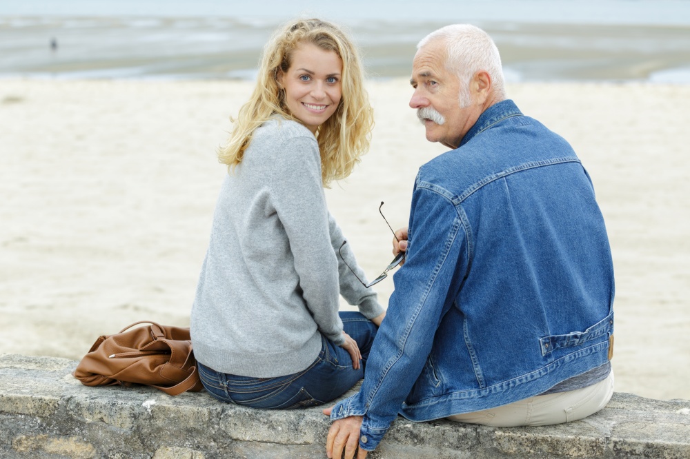 young woman on beach with father