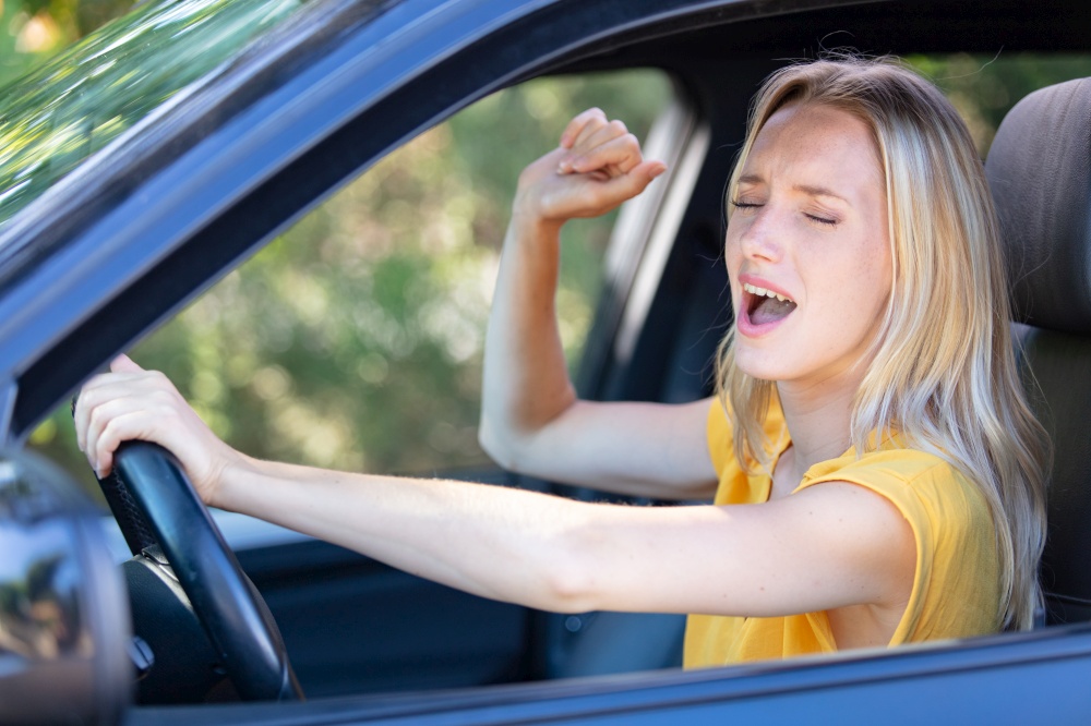 beautiful angry woman honking in her car