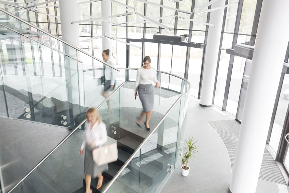 High angle view of businesswomen on staircase at new office