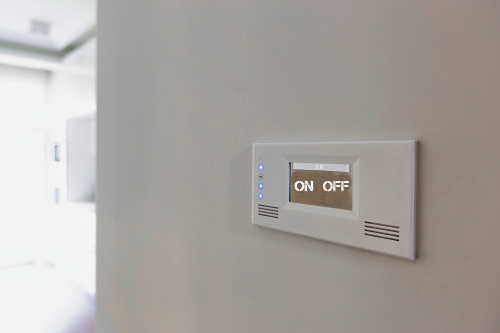 Close up photo of modern touch switch board on wall