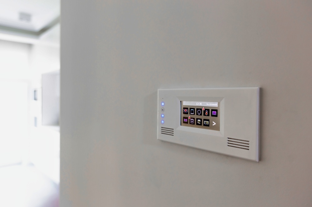 Close up photo of modern touch switch board on wall