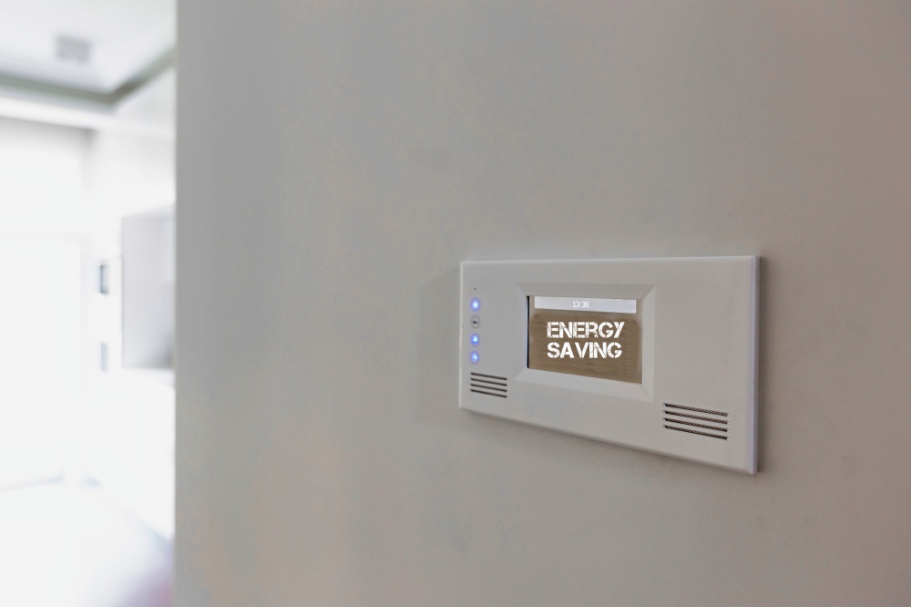 Close up photo of modern energy saving touch switch board on wall
