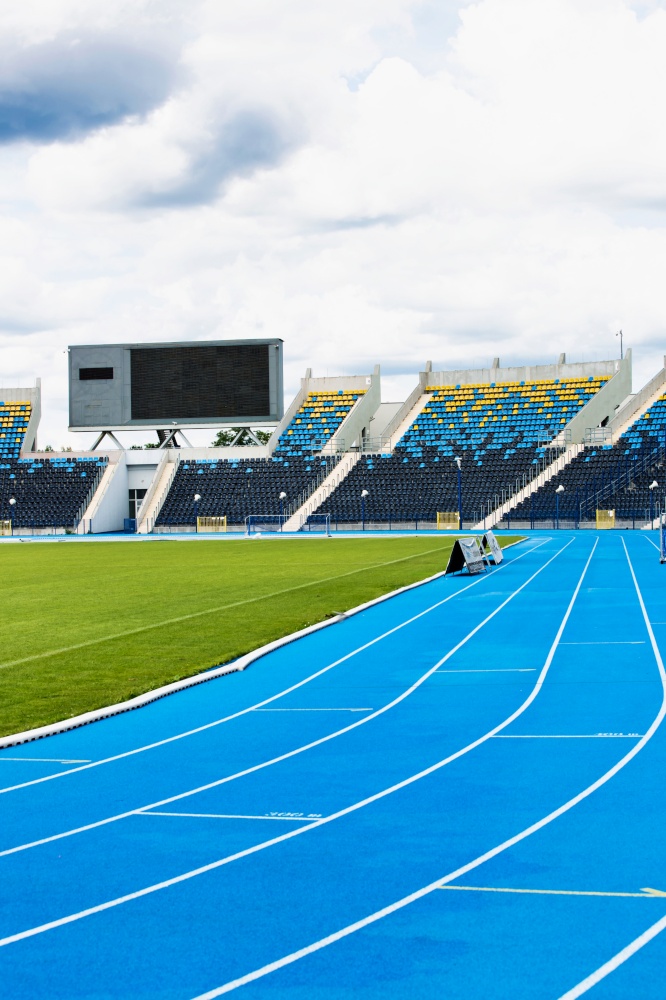 Photo of blue tracking field on stadium