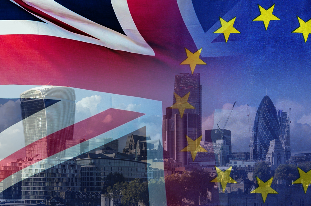 BREXIT concept image of London image and UK and EU flags overlaid symbolising agreement and deal being processed